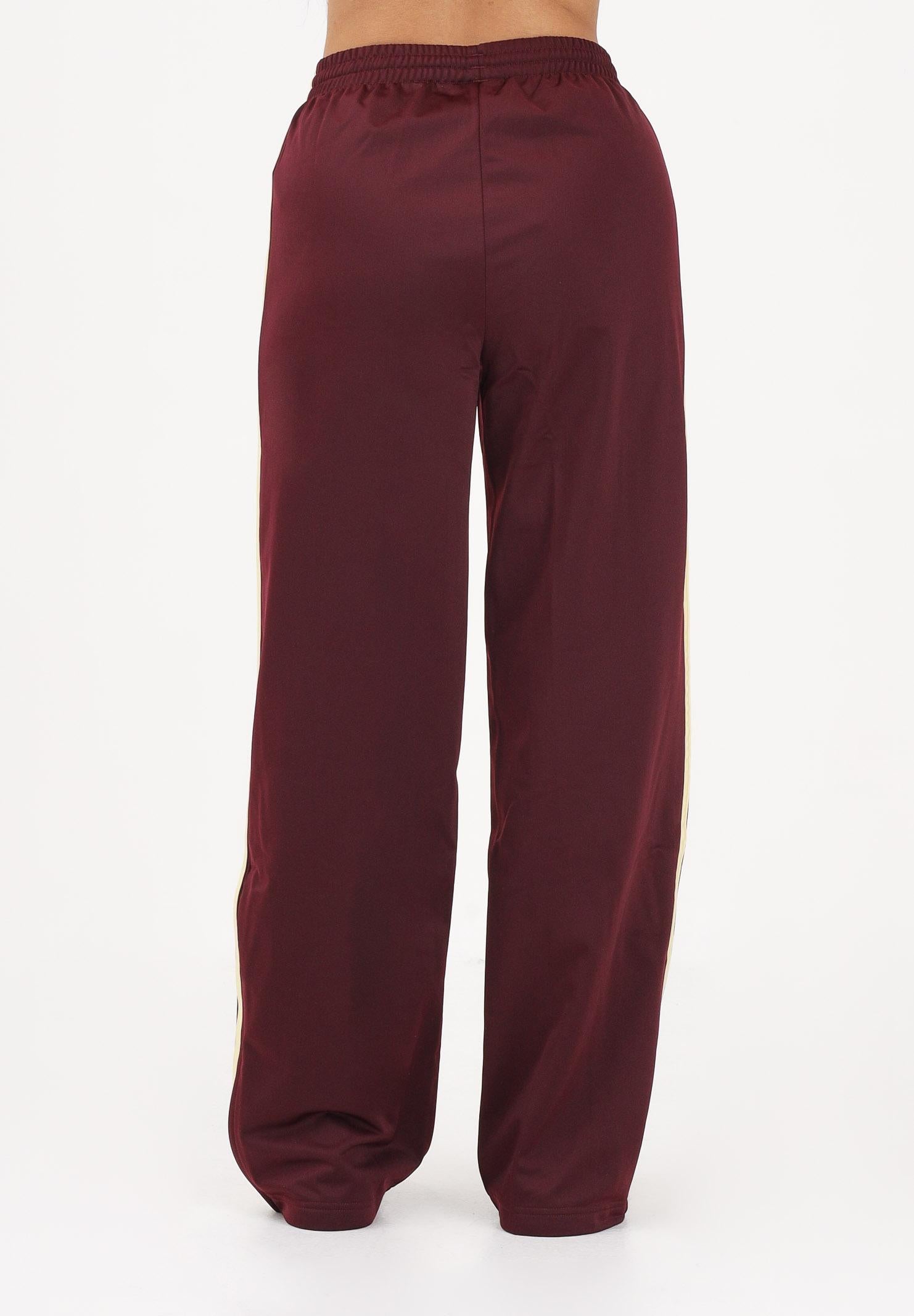 ADIDAS ORIGINALS Pantalone sportivo Firebird bordeaux e giallo da donna KT4626 . ADIDAS ORIGINALS 