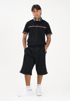 GCDS Shorts sportivo nero per uomo e donna con bande laterali C1MEQL214F004 999B GCDS 