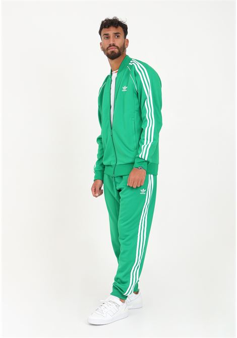 Pantalone da uomo di colore verde. ADIDAS ORIGINALS | Pantaloni | IK3515.
