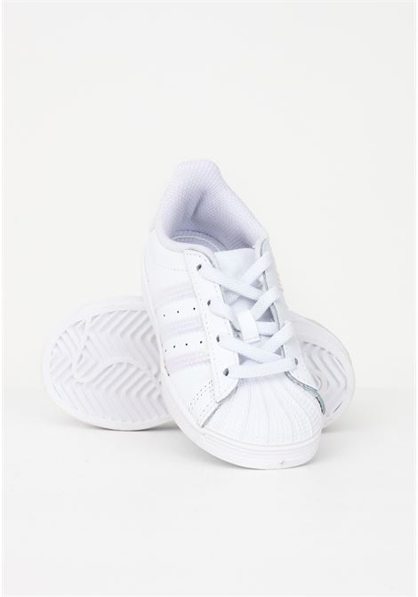 Sneakers Superstar bianca da neonato con bande iridescenti ADIDAS | Sneakers | FV3143.