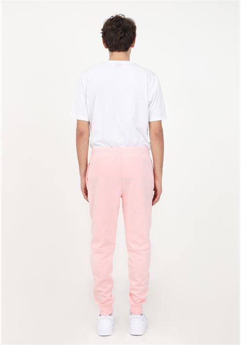 Pantaloni di tuta rosa con logo da uomo LACOSTE | Pantaloni | XH9624T03