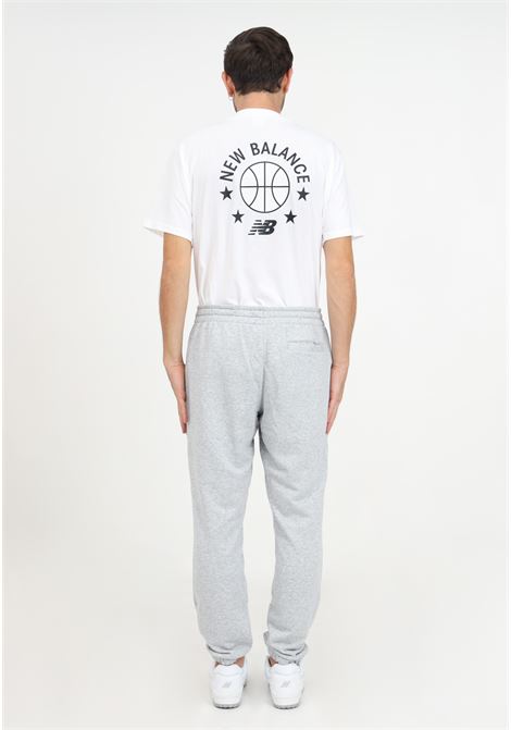 Pantaloni grigi di tuta con stampa logo da uomo NEW BALANCE | Pantaloni | MP33581AG.