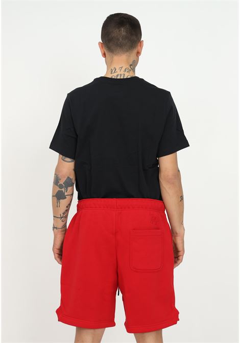 Red unisex jordan essentials shorts with logo on the bottom NIKE | Shorts | DA9826687