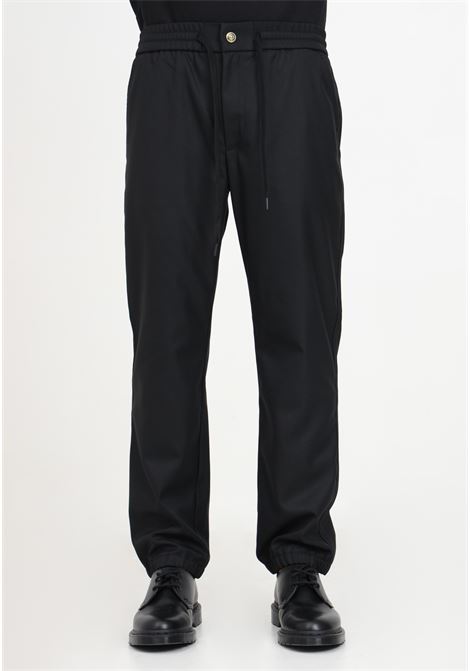 Black trousers with drawstring and logo plate for men VERSACE JEANS COUTURE | Pants | 75GAA100N0220899