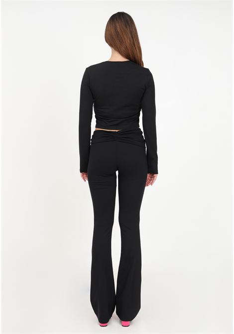 Pantaloni neri con logo in gomma da donna VERSACE JEANS COUTURE | Pantaloni | 75HAA323J0089899