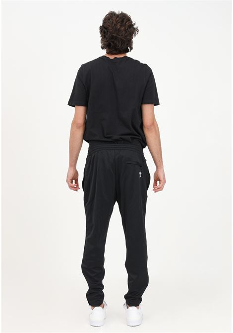 Pantalone sportivo Rekive Slim nero da uomo ADIDAS | HK7349.