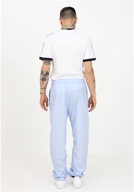 Light blue sports trousers for men and women ADIDAS | HR5461.