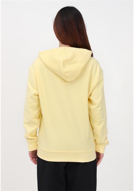 Felpa gialla da donna con cappuccio e maxi stampa logo ADIDAS | IB7434.