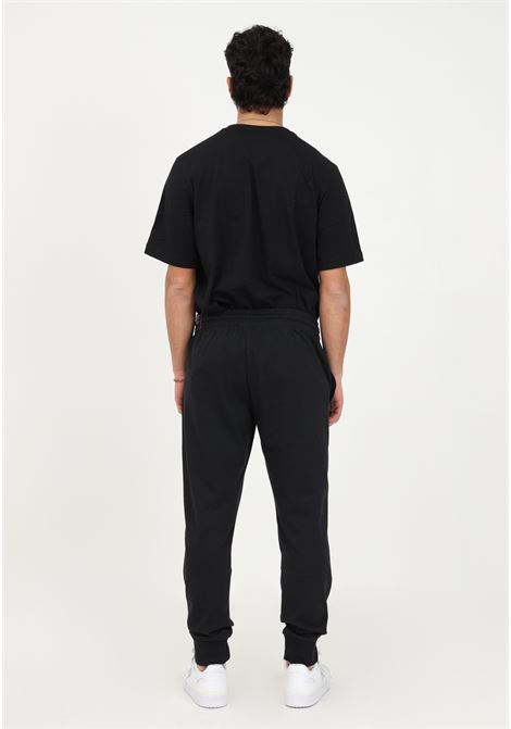 Pantalone sportivo nero da uomo Essentials Single Jersey Tapered Cuff ADIDAS | IC9417.