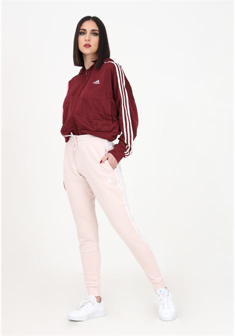 Pink sports pant for women in French terry essentials with 3 stripes ADIDAS | IC9924.