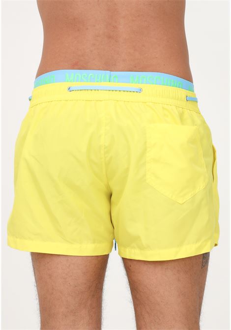 Shorts mare giallo da uomo con elastico logato MOSCHINO | Beachwear | A421693010021