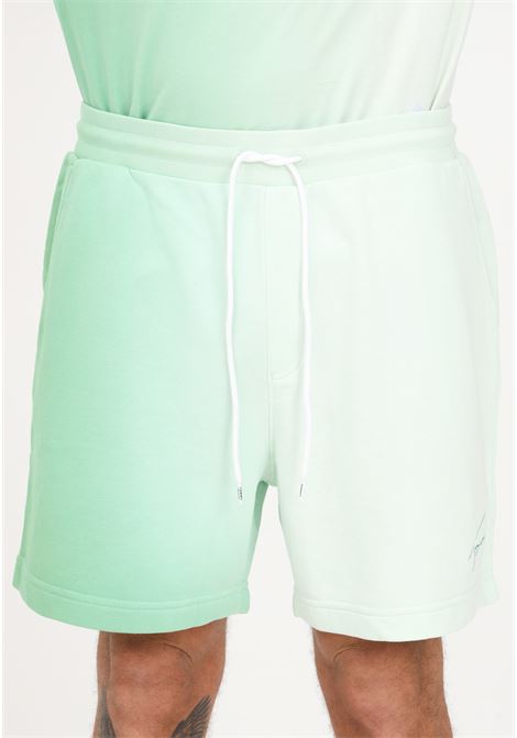 Shorts casual verde da uomo con motivo dip-dye e ricamo logo TOMMY HILFIGER | Shorts | DM0DM16332LY3LY3