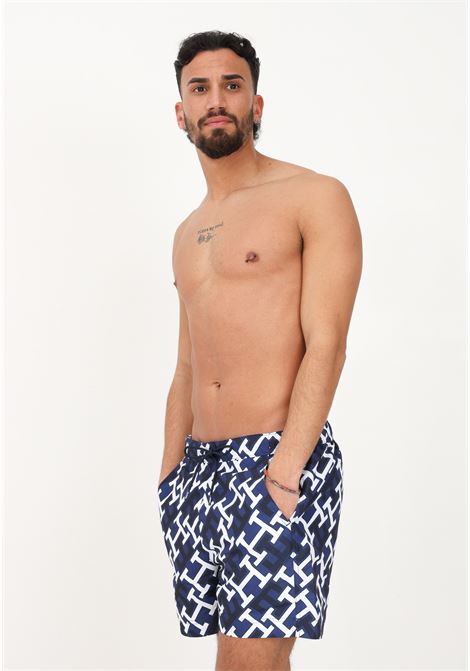 Shorts mare blu da uomo con logo TH all-over TOMMY HILFIGER | Beachwear | UM0UM028460Z1