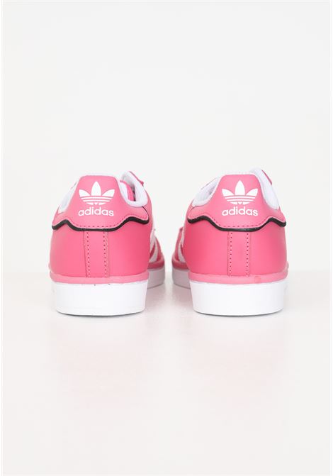 Pink women's sneakers with 3 white SUPERSTAR stripes ADIDAS ORIGINALS | Sneakers | IE0863.