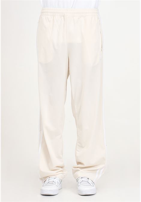 Pantaloni beige Firebird Tp da uomo ADIDAS ORIGINALS | Pantaloni | IM9477.