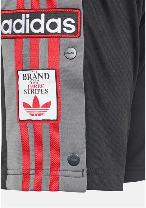 Shorts bambina bambino neri con strisce laterali grigie e rosse patch logo ADIDAS ORIGINALS | Shorts | IN2119.
