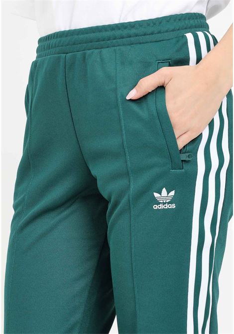 Green women's trousers with side stripes montreal ADIDAS ORIGINALS | Pants | IP0628.
