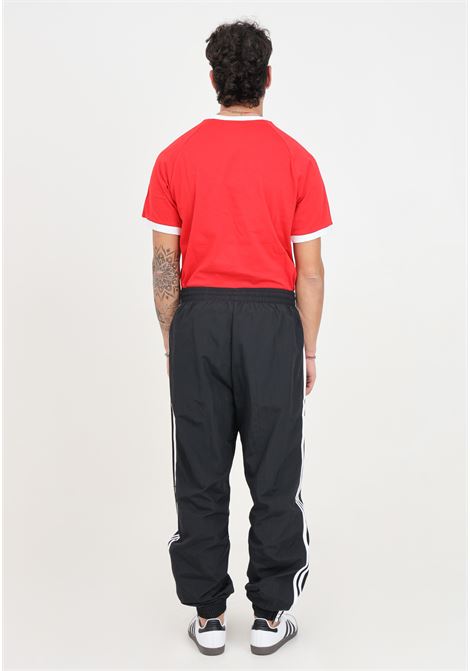 Pantaloni da uomo neri woven firebird track ADIDAS ORIGINALS | IT2501.