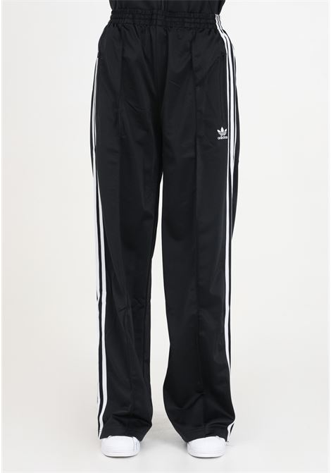 Pantaloni da donna neri joggers Firebird Loose con righe verticali ADIDAS ORIGINALS | IT7404.