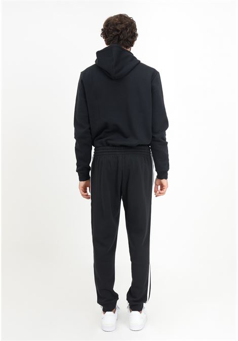 Pantalone Essentials Fleece 3-Stripes Tapered Cuff nero da uomo ADIDAS PERFORMANCE | Pantaloni | IB4030.
