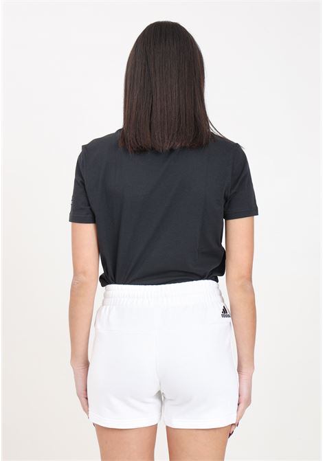 White women's shorts with black logo print on the front ADIDAS PERFORMANCE | IC6875.