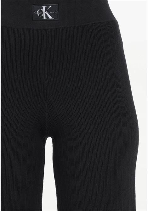Women's black flared trousers in ribbed stretch cotton CALVIN KLEIN JEANS | Pants | J20J222599BEHBEH