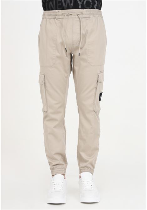Men's skinny beige washed cargo trousers with Plaza Taupe logo CALVIN KLEIN JEANS | Pants | J30J324696PEDPED