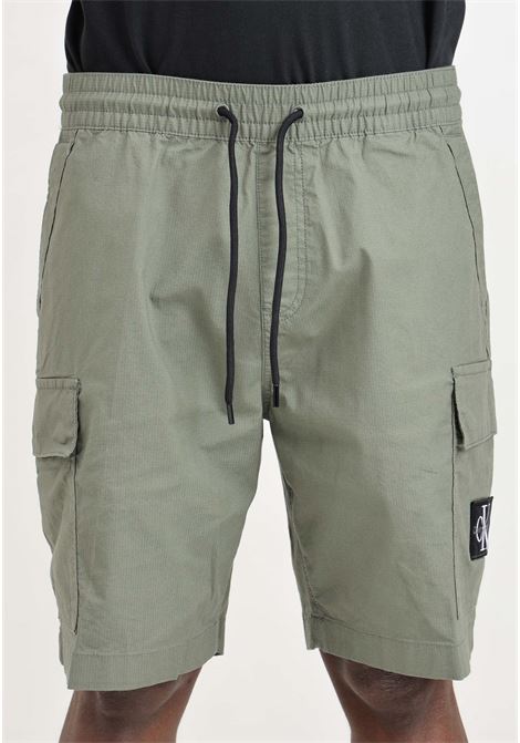 Olive green men's shorts with logo patch on the front CALVIN KLEIN JEANS | Shorts | J30J325138LDYLDY