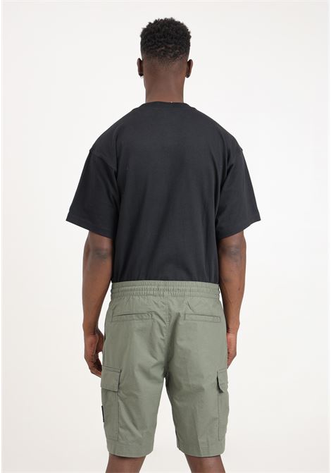 Olive green men's shorts with logo patch on the front CALVIN KLEIN JEANS | Shorts | J30J325138LDYLDY