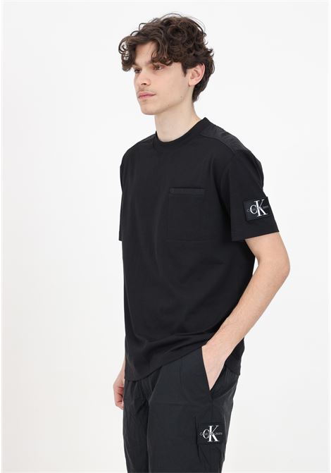T-shirt da uomo nera con retro materiale misto CALVIN KLEIN JEANS | T-shirt | J30J325215BEHBEH
