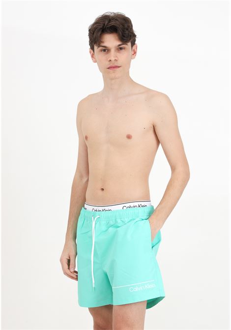 Aqua green men's swim shorts with logo print and logoed elastic waistband CALVIN KLEIN | Beachwear | KM0KM00957LB9
