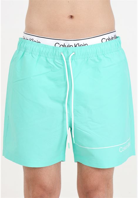 Aqua green men's swim shorts with logo print and logoed elastic waistband CALVIN KLEIN | Beachwear | KM0KM00957LB9