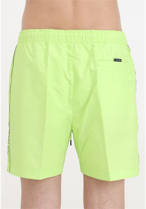 Men's neon swim shorts with logoed side bands CALVIN KLEIN | KM0KM00958LKQ