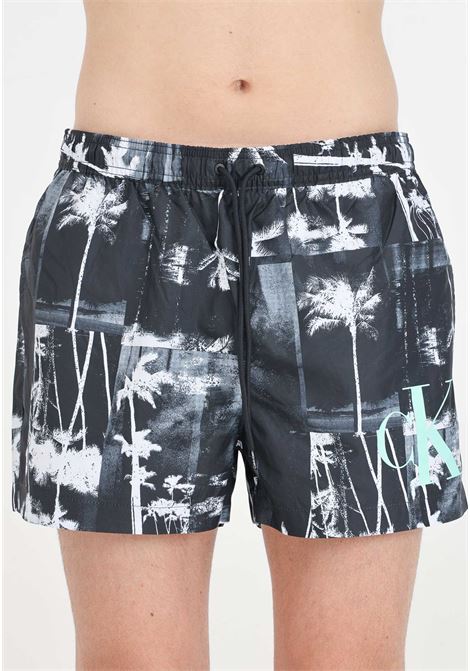 Black men's swim shorts with palm tree print and maxi monogram logo CALVIN KLEIN | Beachwear | KM0KM009680GL