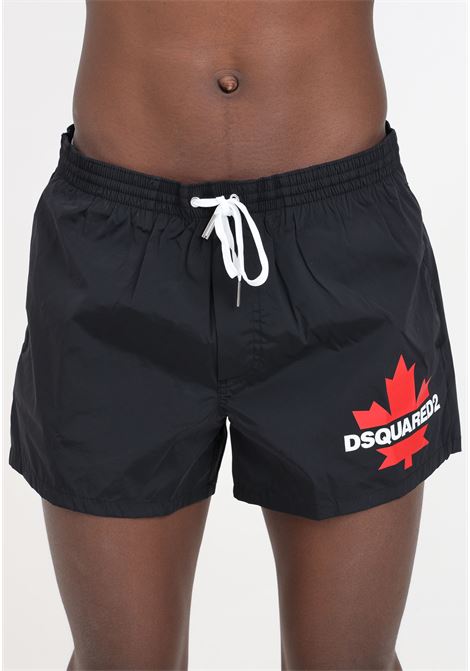 Shorts mare neri da uomo con stampa logo DSQUARED2 | Beachwear | D7B5F5600002