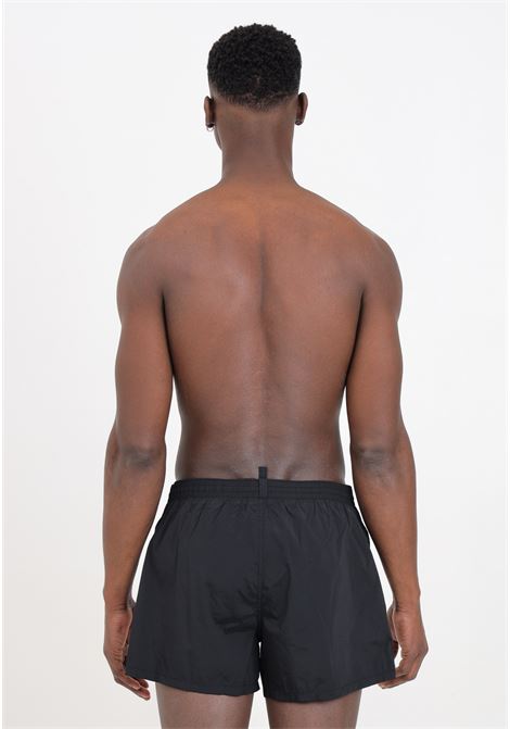 Shorts mare neri da uomo con stampa logo DSQUARED2 | Beachwear | D7B5F5600002