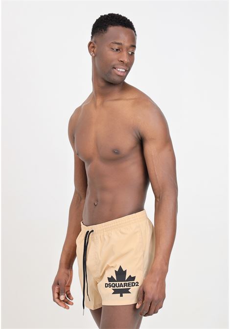 Shorts mare beige da uomo con stampa logo DSQUARED2 | Beachwear | D7B5F5600921
