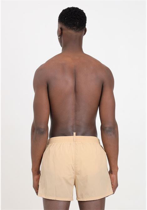 Shorts mare beige da uomo con stampa logo DSQUARED2 | Beachwear | D7B5F5600921