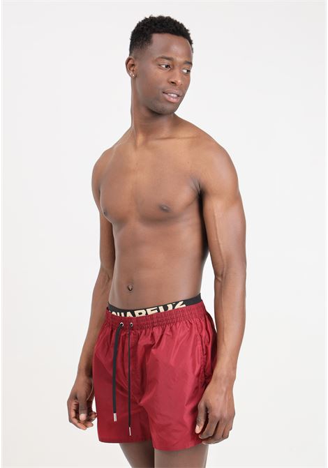 Burgundy men's swim shorts with elastic logo band at the waist DSQUARED2 | D7B645490604