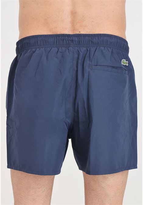 Shorts mare blu notte con stampa logo sul davanti e patch logo LACOSTE | MH6912166