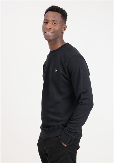 Black men's sweater with golden eagle logo patch LYLE & SCOTT | Knitwear | ML424VOGEZ865