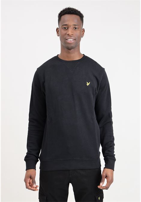 Black men's sweater with golden eagle logo patch LYLE & SCOTT | Knitwear | ML424VOGEZ865