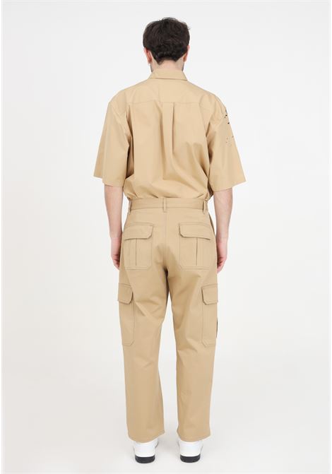Pantaloni da uomo beige in gabardina stretch metal lettering MOSCHINO | Pantaloni | A036020210148