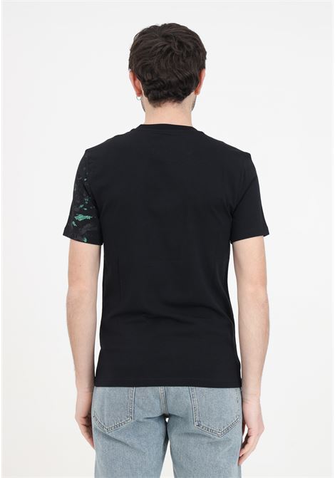 T-shirt nera da uomo painted effect MOSCHINO | A071920391555