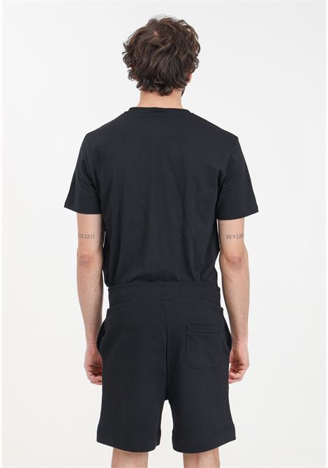 Shorts da uomo neri con stampa logo a colori MOSCHINO | A670394100555