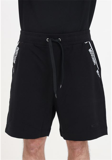 Pantaloncini neri da uomo con cordoncino e logo in basso MOSCHINO | Shorts | A681844220555
