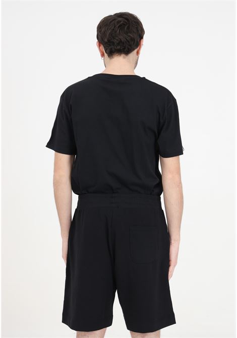 Pantaloncini neri da uomo con cordoncino e logo in basso MOSCHINO | Shorts | A681844220555
