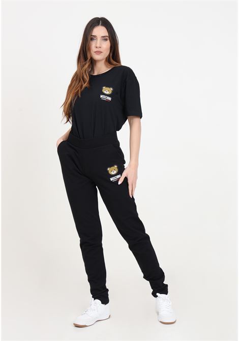 Black women's trousers with logo patch MOSCHINO | Pants | A689044090555