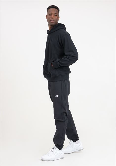 Black men's athletics stretch woven jogger trousers NEW BALANCE | Pants | MP41510BK001