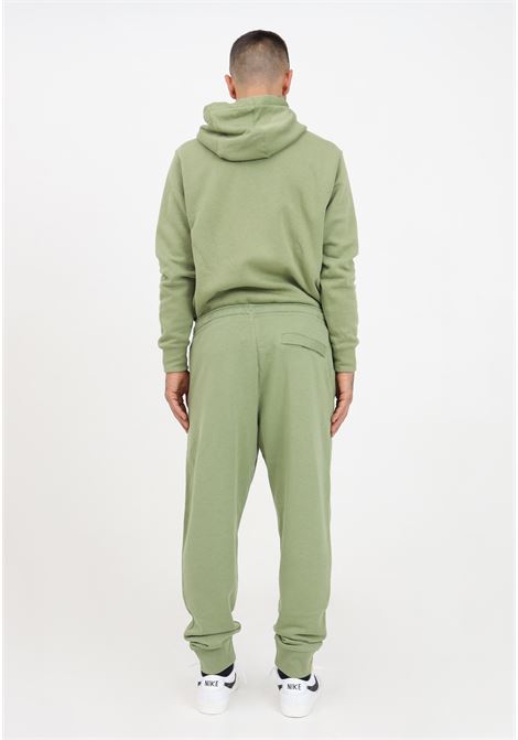 Pantaloni tuta da uomo e da donna  in misto cotone di colore verde asparago. NIKE | Pantaloni | BV2679334